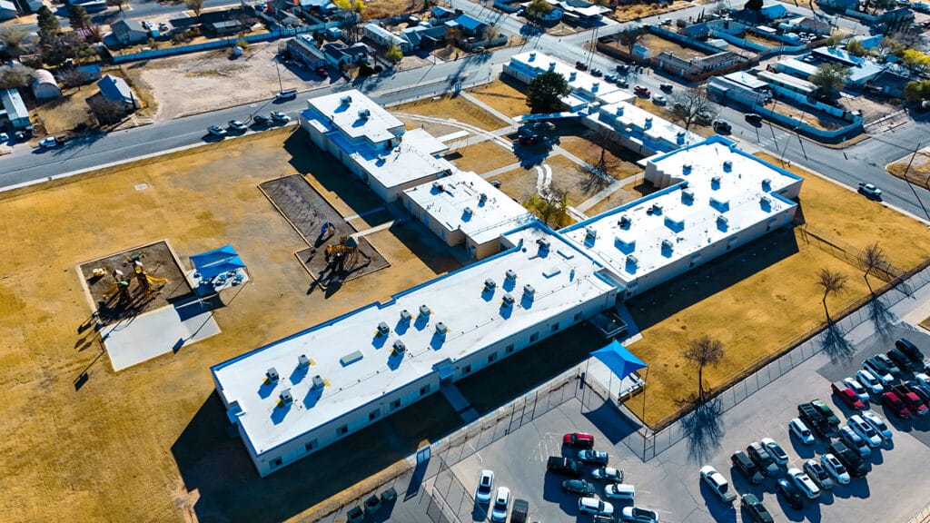 Middle school roofing job by Roofs Inc
